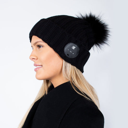 Woman Bluetooth Beanie With Black Faux Fur Pom Pom - Black | Caseco inc. (Side-Beanie)