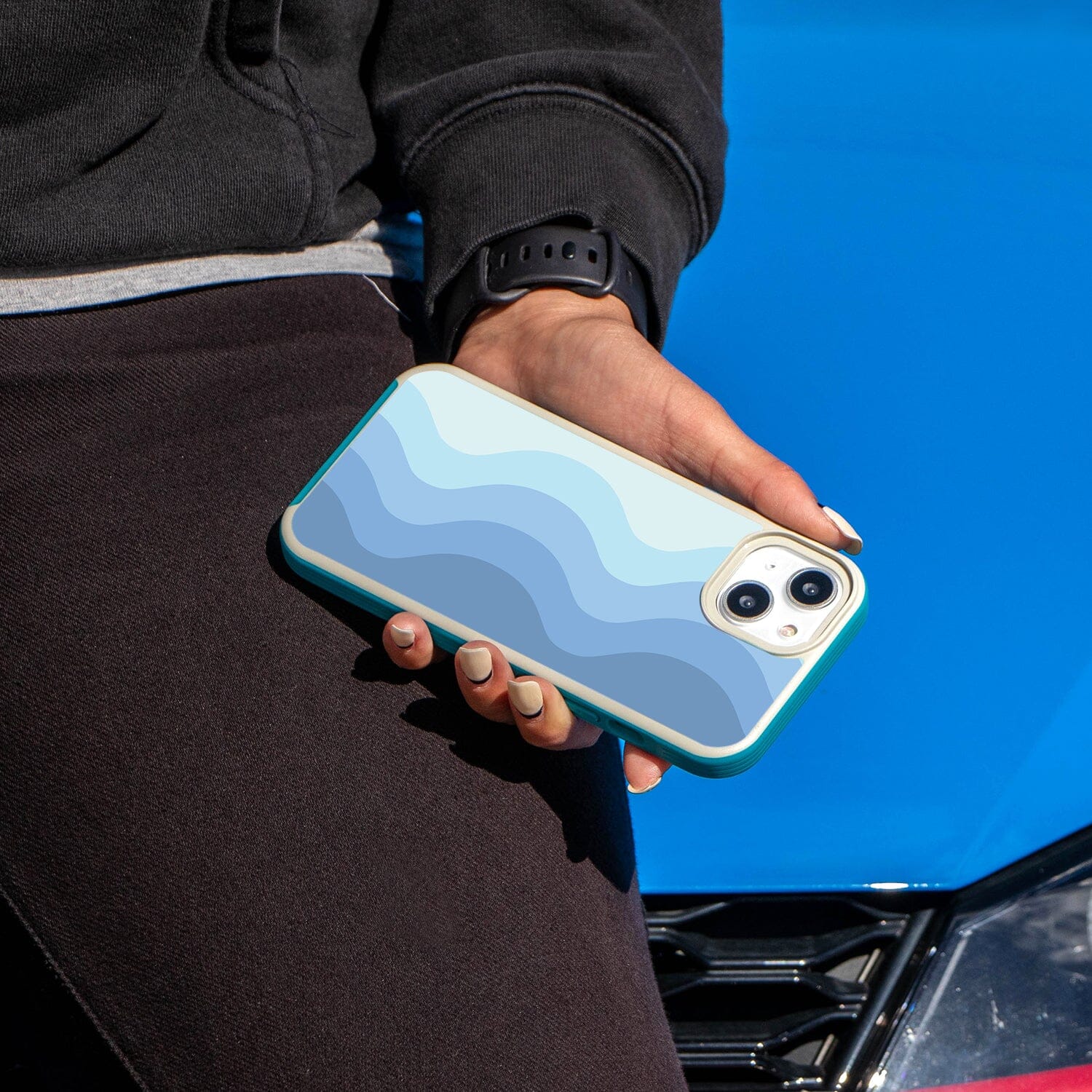 iPhone 14 Blue Wave Design Case - Fremont Grip (Girl in Black holding a Phone)