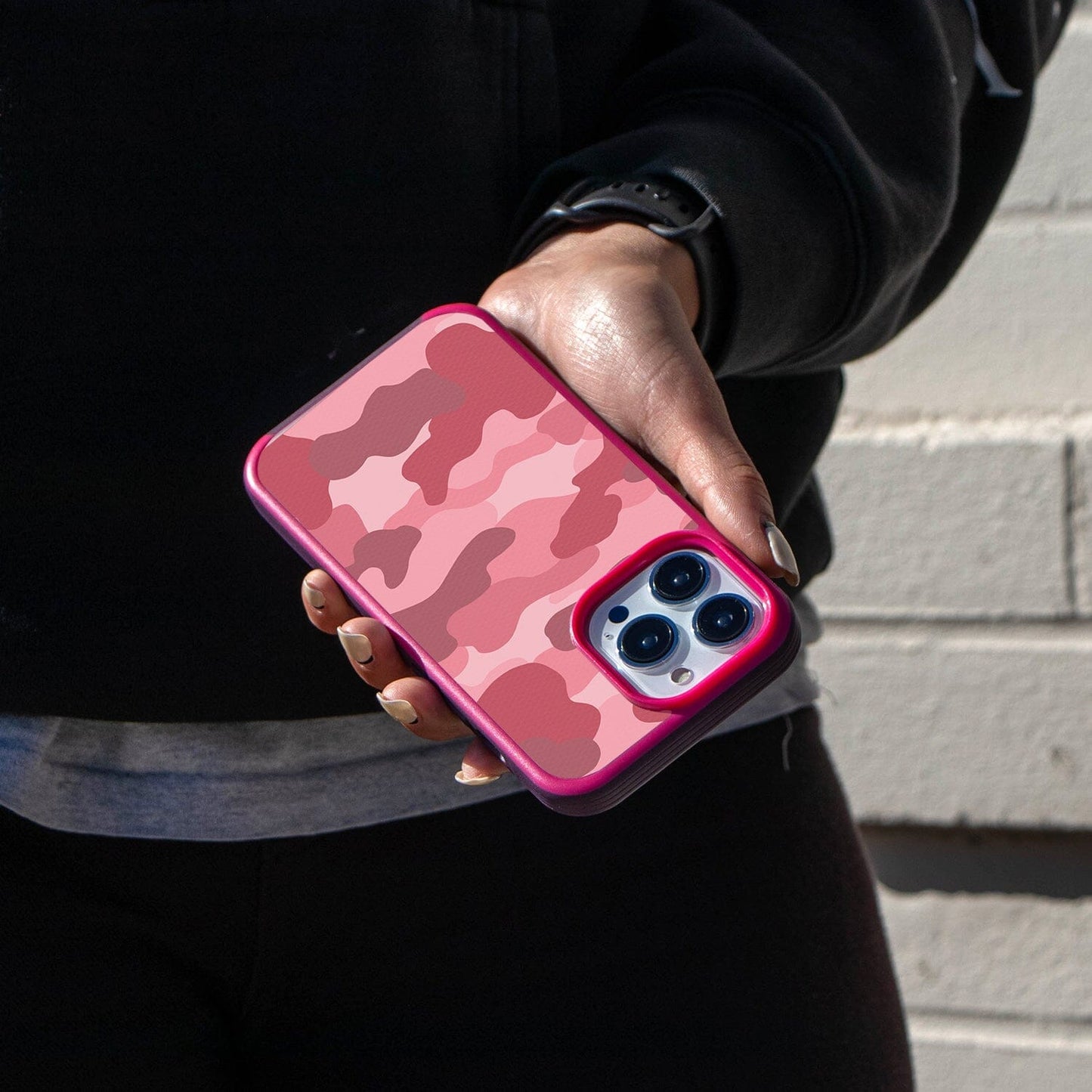 iPhone 14 Pro Pink Camo Design Case - Fremont Grip Lifestyle Shot (Girl in Black Holding Her Phone)