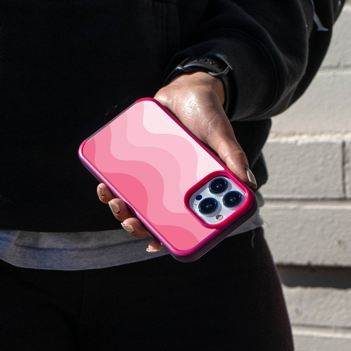 iPhone 14 Pro Pink Wave Design Case - Fremont Grip (Girl in Black Holding a Phone)